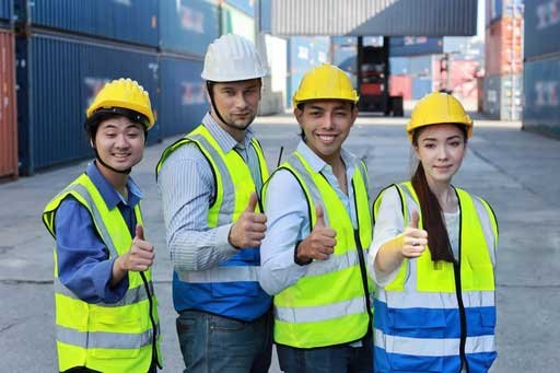 Asian workers celebrating onboarding success via fast recruitment from India and Nepal to Europe