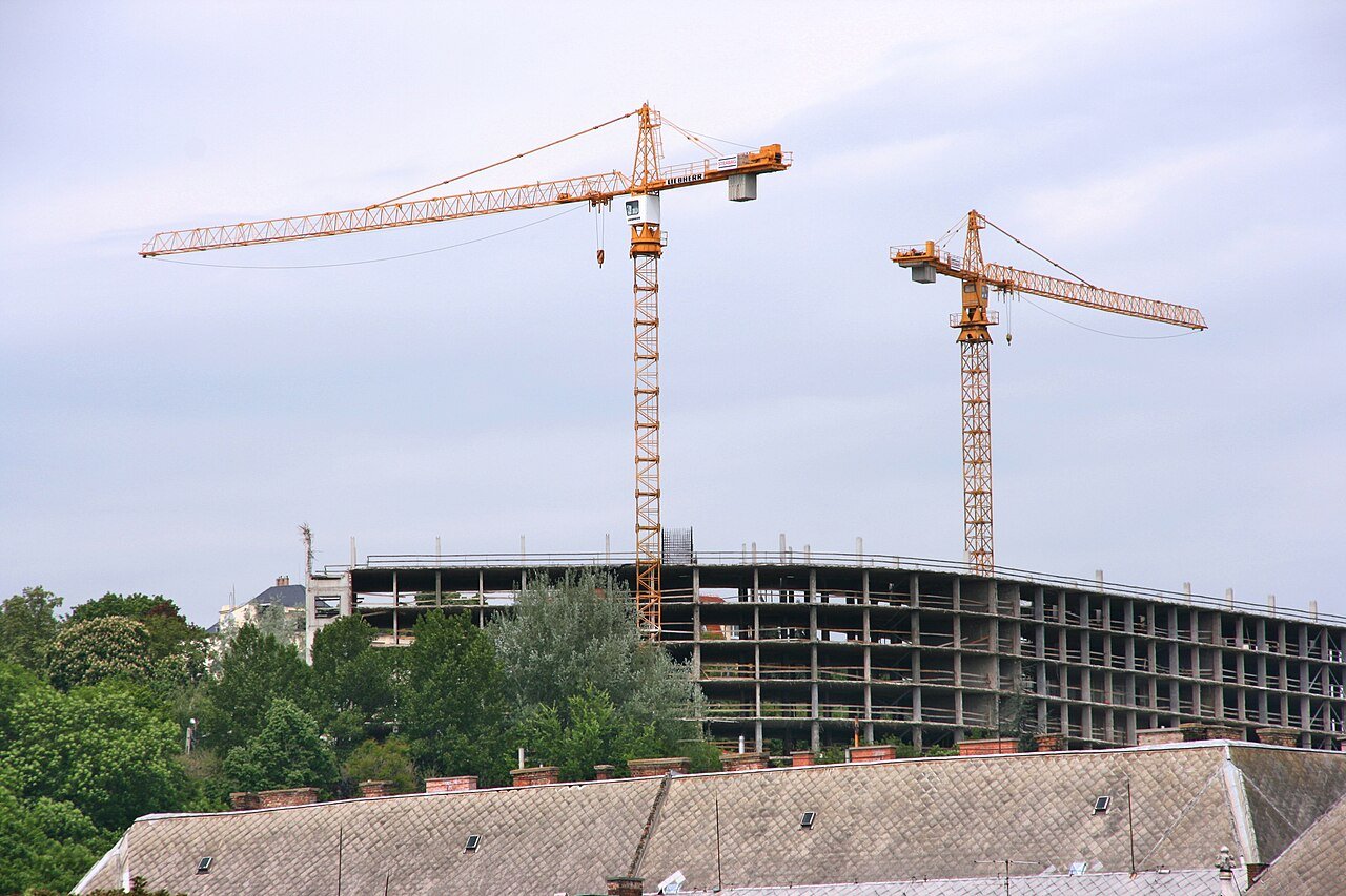 Tower cranes over a construction site in Europe